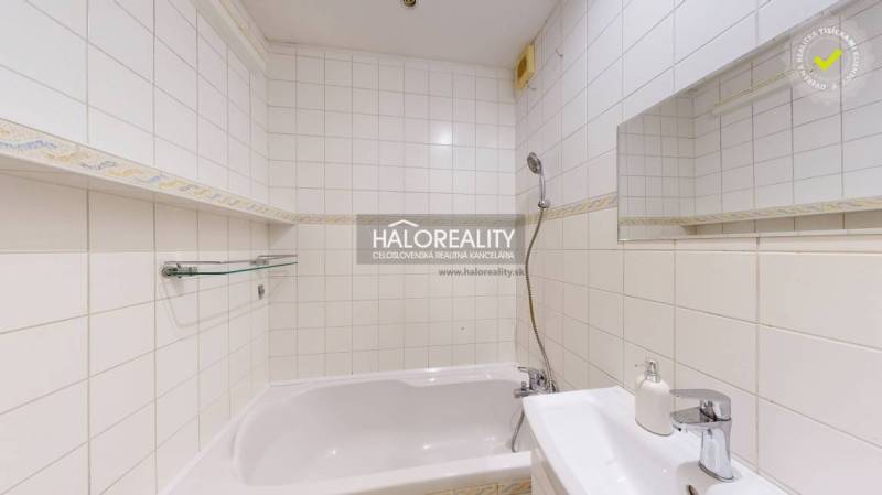 Bathroom in a 2-room apartment with a shower and a bathtub, bright tiles.