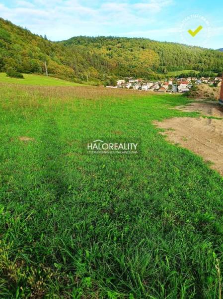 A view of residential plots in Margecany surrounded by wooded countryside.