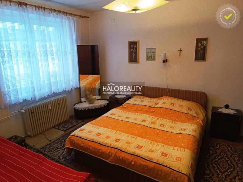 A bedroom with a large bed and decorative elements in a two-room apartment.
