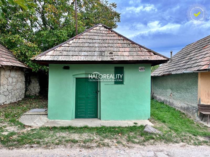 Green house with a gable roof in the gardens of Mýtne Ludany.