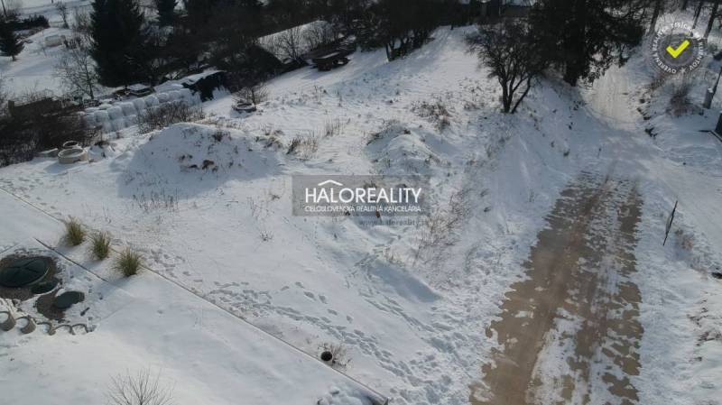 Snow cover on residential plots in Liptovské Beharovce, winter landscape.