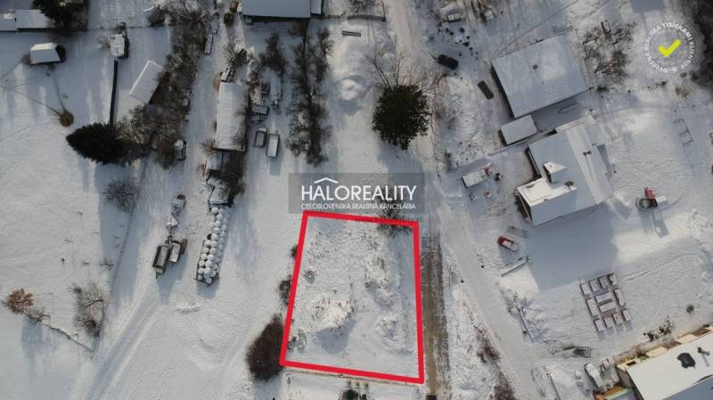 Snow-covered plot for sale in Liptovské Beharovce, suitable for living.
