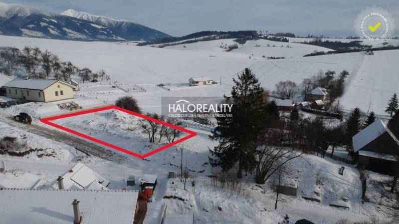 Snow-covered residential lands in Liptovské Beharovce with a beautiful mountain view.