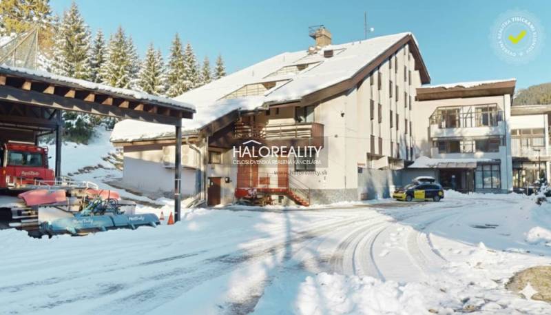 A snow-covered area of a hotel complex and parking lot in Vyšná Boca, suitable for hotels and guesthouses.