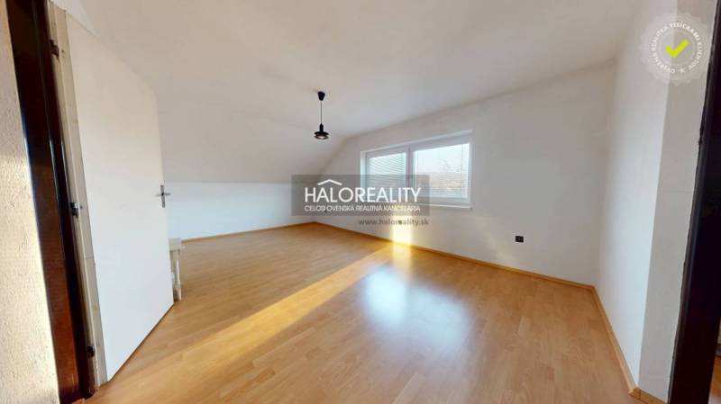 A bright room with wood-decor flooring in a family house, large windows.