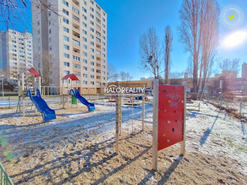 A playground with climbing frames in winter near a block of flats in Petržalka, Bratislava.