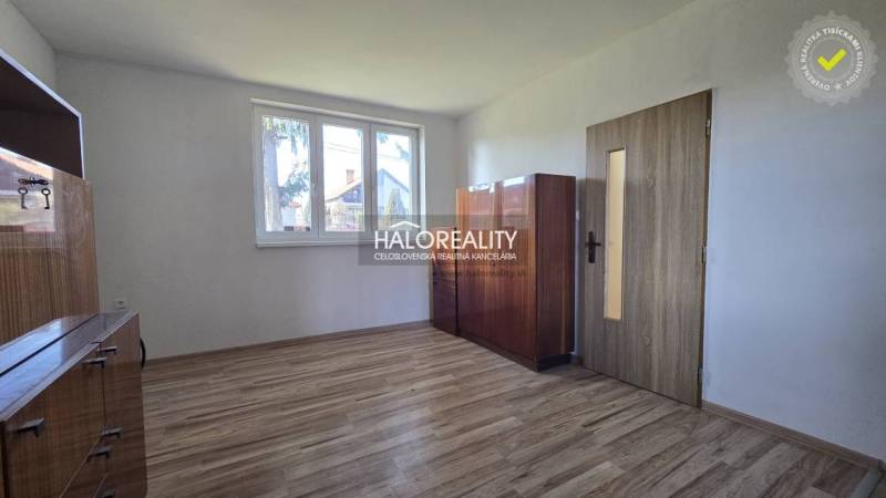Interior of a family house with a wooden decor floor and light furniture.