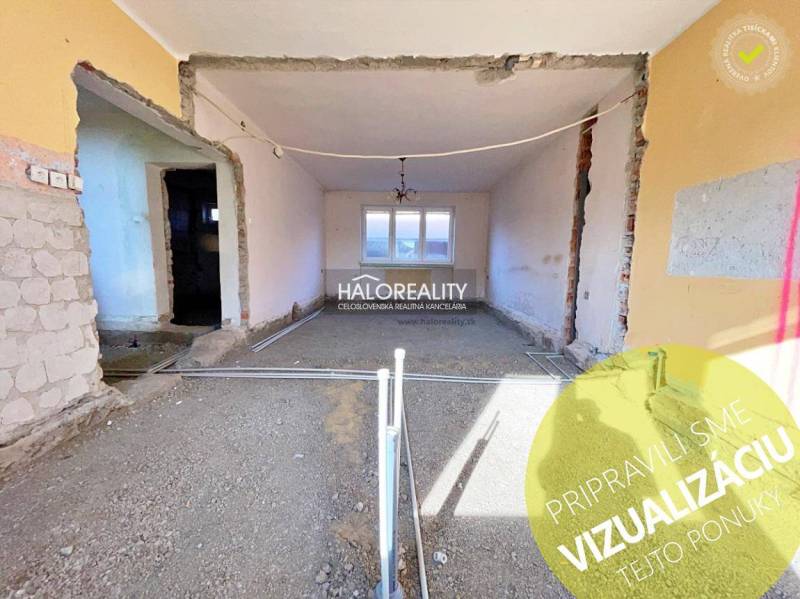 A house under renovation with exposed walls and bare floors.