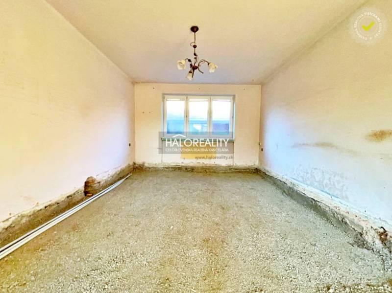 An empty room with an unfinished floor in a family house.