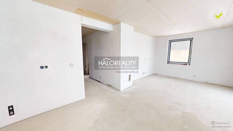 An unfinished interior with white walls and an open floor plan in an office.