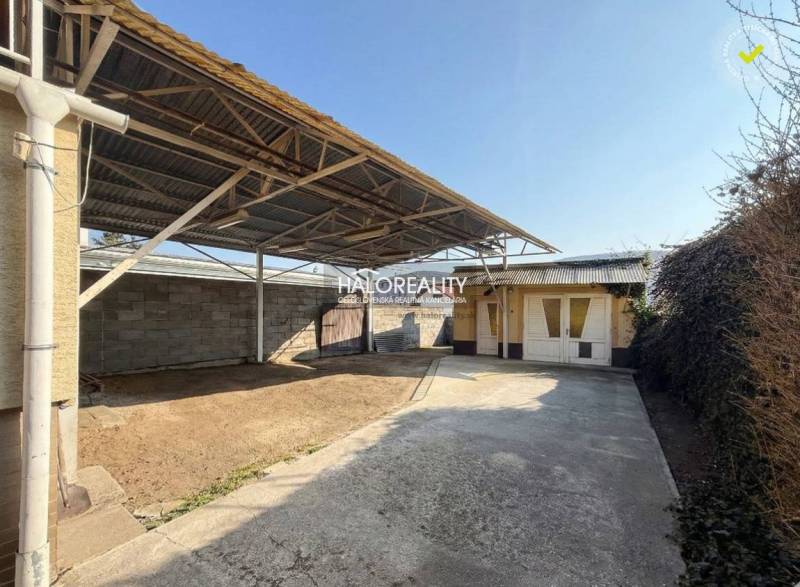 A family house in Dolné Vestenice with a covered courtyard and a carport.