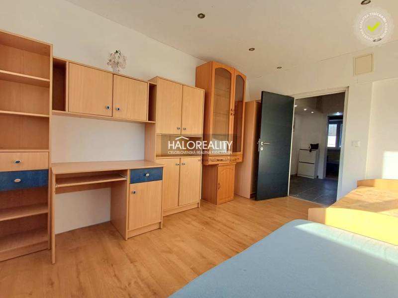 A room with wooden decor furniture and flooring in a 3-room apartment.