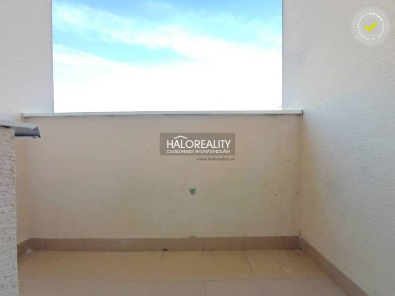 Balcony of a 3-room apartment in Handlová, view of the open space and the sky.