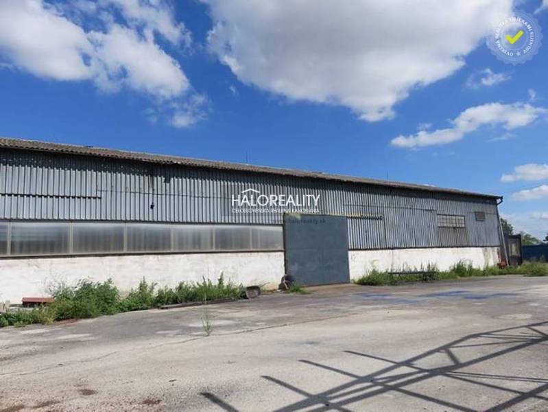 Warehouses and halls in Hurbanova Ves with steel structures under the blue sky.