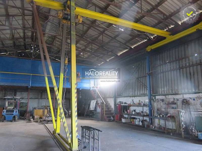 Industrial hall interior with a crane and work tools in warehouses and halls.