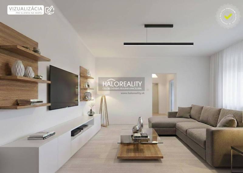 Living room with a television, sofa, and wooden decor flooring in a family house.