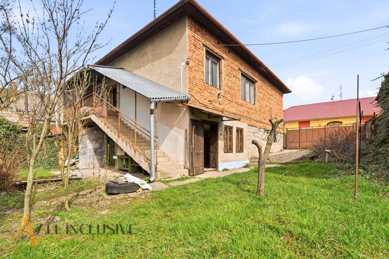 A family house in Malá nad Hronom with access via an external staircase and a garden.