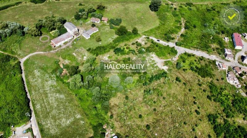 Aerial view of residential plots in Tornaľa with surrounding greenery.