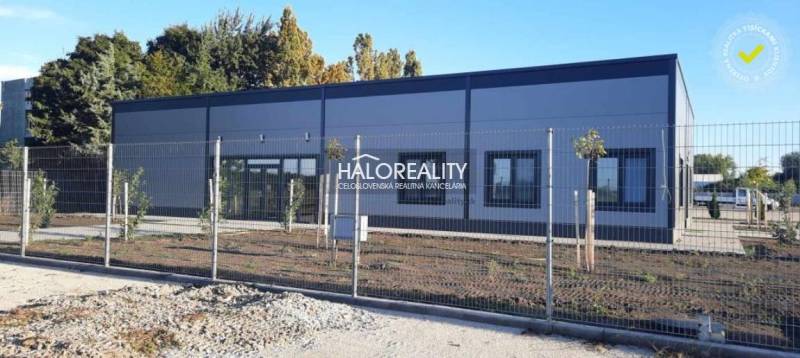 A building with a modern design on a fenced plot in the town of Tornaľa, suitable for living.