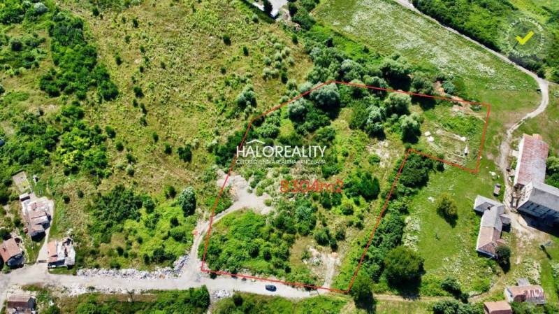 Aerial view of extensive residential land in Tornaľa, surrounded by greenery.