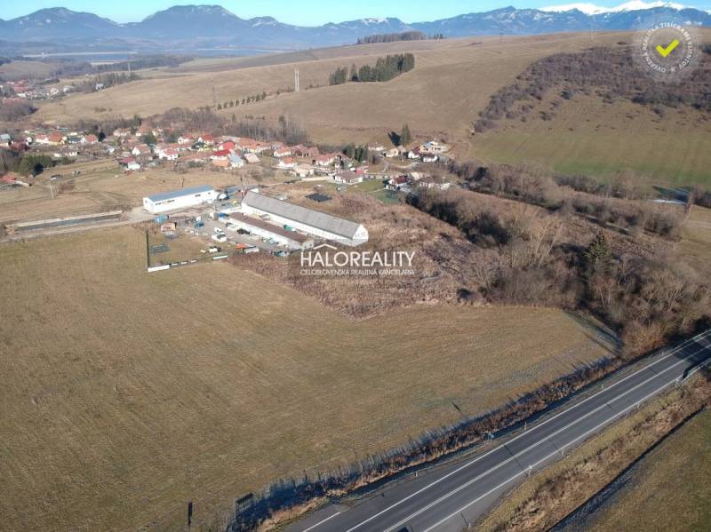 Aerial view of residential plots in Gôtovany with a mountain panorama on the horizon.