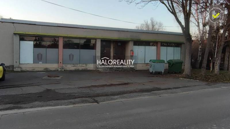 Property for sale: building with display windows, suitable for commercial spaces, main street.