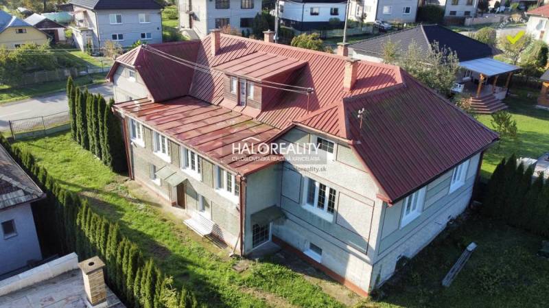 A family house in Hrachovo with a red roof and a picturesque garden in a quiet location.