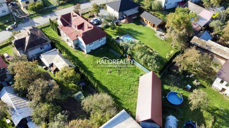 Aerial view of family houses in Hrachovo with spacious gardens and a swimming pool.
