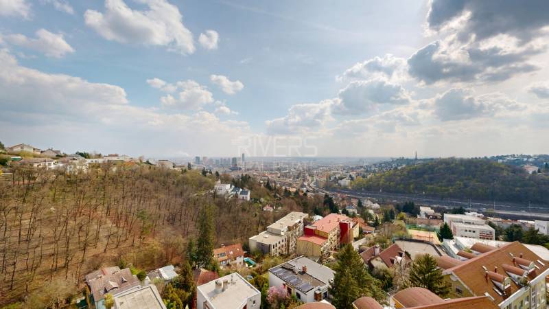 View of Bratislava from the Vinohrady area with high-rise buildings and greenery.