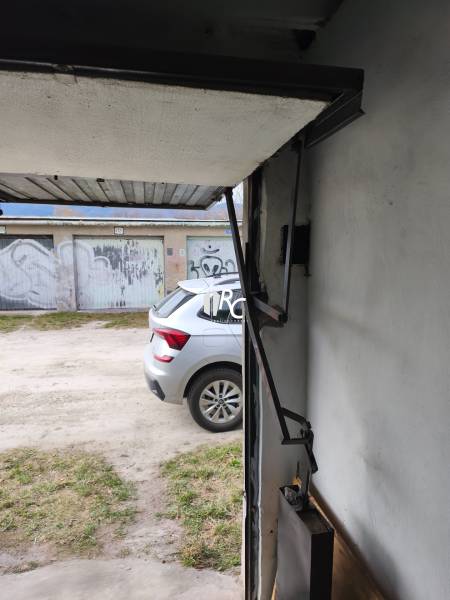 View from the garage on Kozmonautov Street in Martin, car parked in front of the garage.
