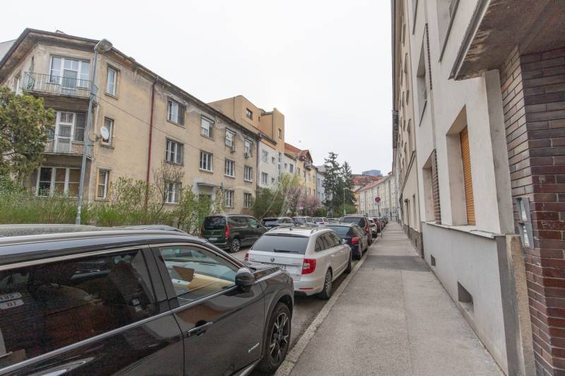Šoltésová Street in Bratislava - Staré Mesto with a row of cars and residential buildings.