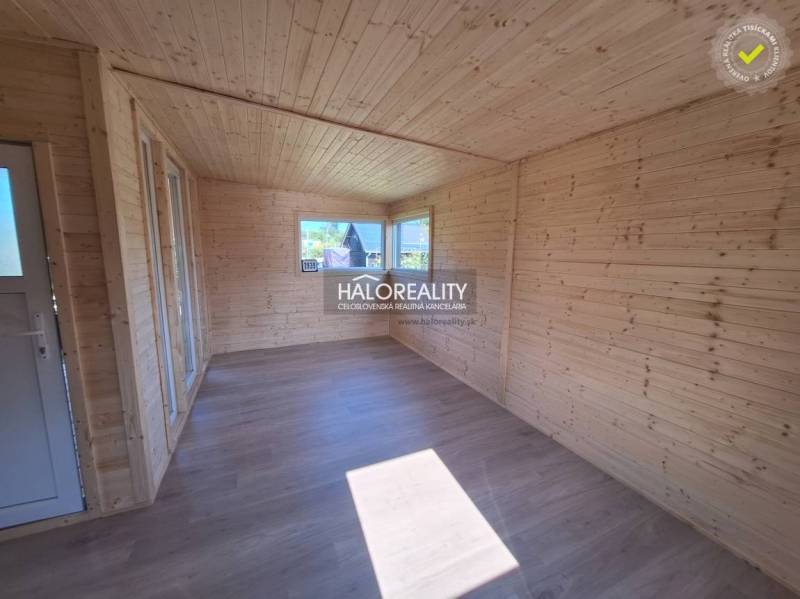 Wooden interior with large windows in the Gardens, bright space with laminate flooring.