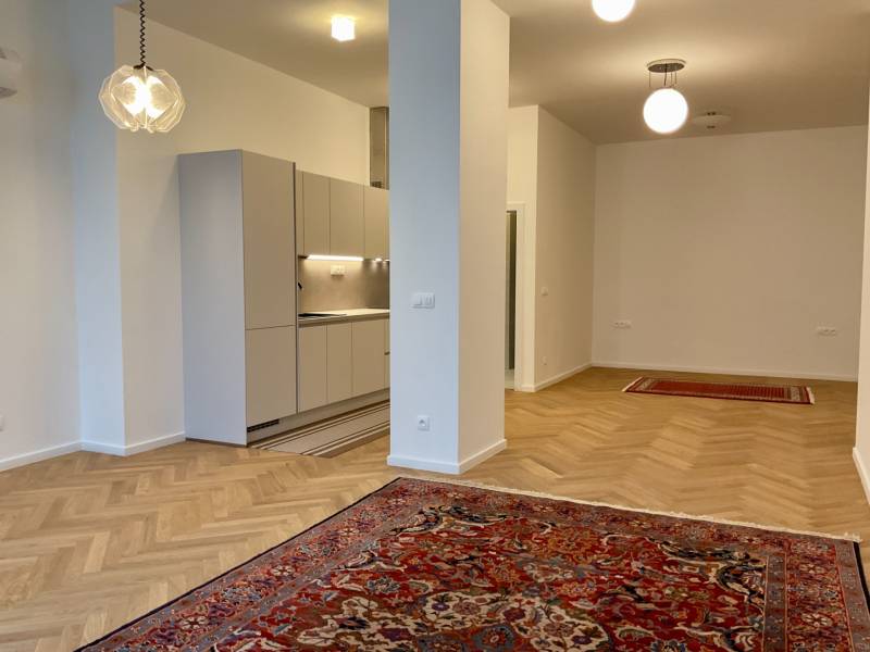 Interior of a 2-room apartment with a wooden decor floor and carpets.
