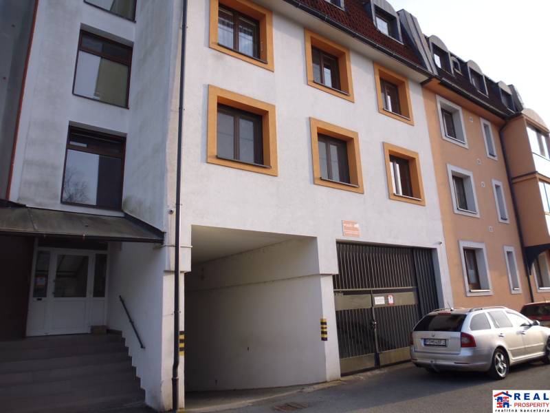 The exterior of the building on Veselá Street in Prešov includes a parking lot and an entrance.