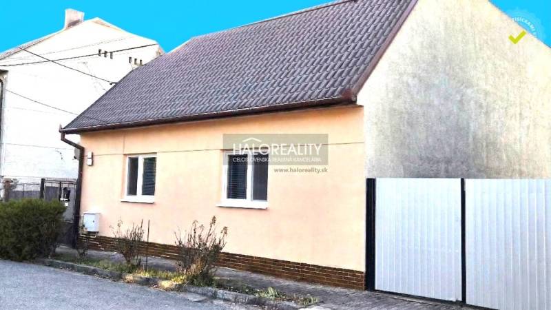 A family house in Lučenec with a simple facade and a sloped roof.