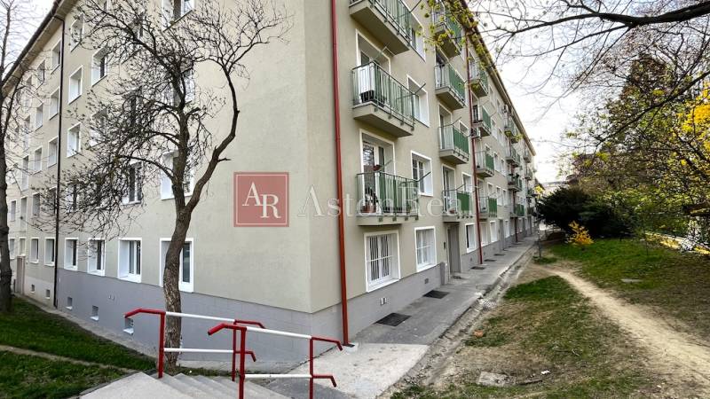 Apartment building on Šuňavcova Street in Bratislava - Nové Mesto, with landscaped grounds.