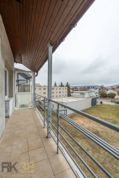 The balcony of a 4-room apartment in Poprad with a view of the urban landscape.