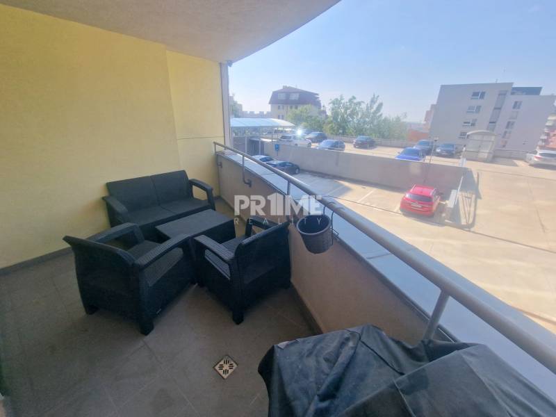 Balcony of a 2-room apartment on Majerníková Street in Bratislava – Karlova Ves with outdoor seating.