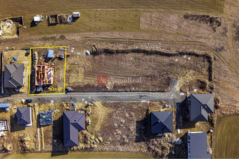 Aerial view of a construction site with a family house under construction in Tvarožná.