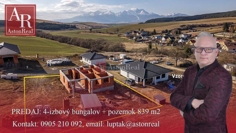 A family house in Tvarožná with construction work in the background of a mountain massif.