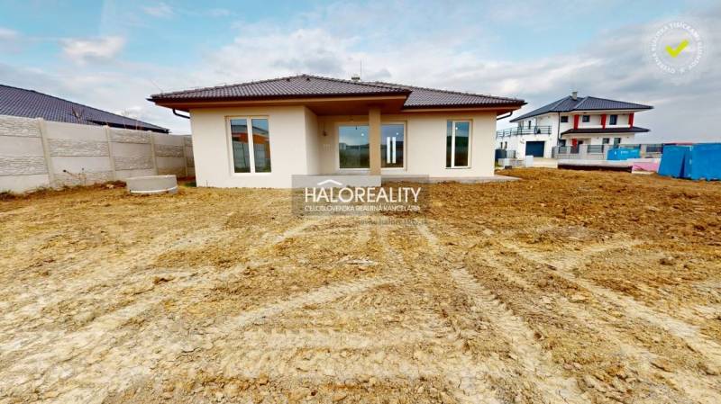 A family house in Rimavské Janovce with a flat roof and a spacious plot.