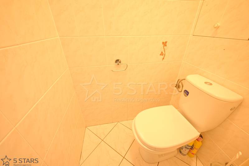 Bathroom with toilet and tiles in a 3-room apartment.