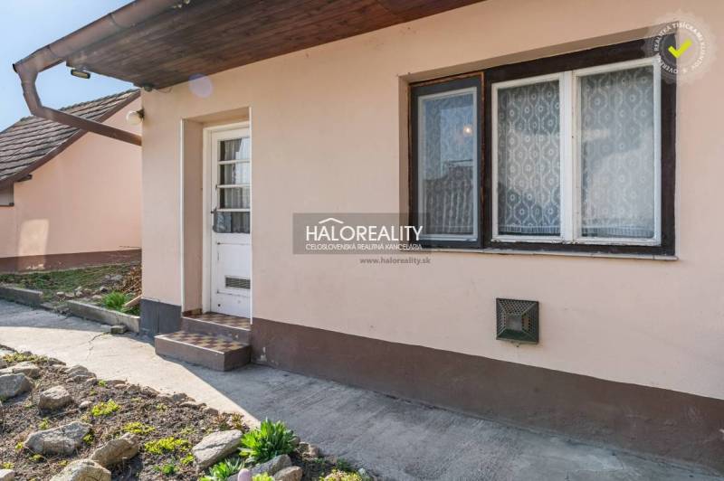 Entrance to a family house in Horná Potôň with a small garden and a pathway.