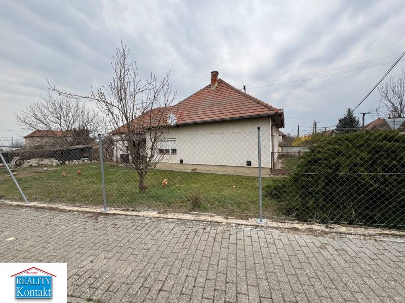 A family house on Bočná Street in Mojzesovo with a grassy plot and fencing.