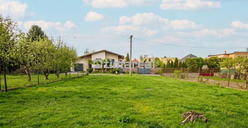 A family house in Trstín with a green lawn and fruit trees on a spacious plot.