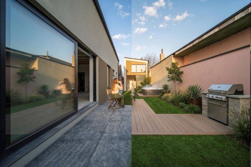 A terrace of a family house in Poprad with a hot tub, grill, and green lawn.