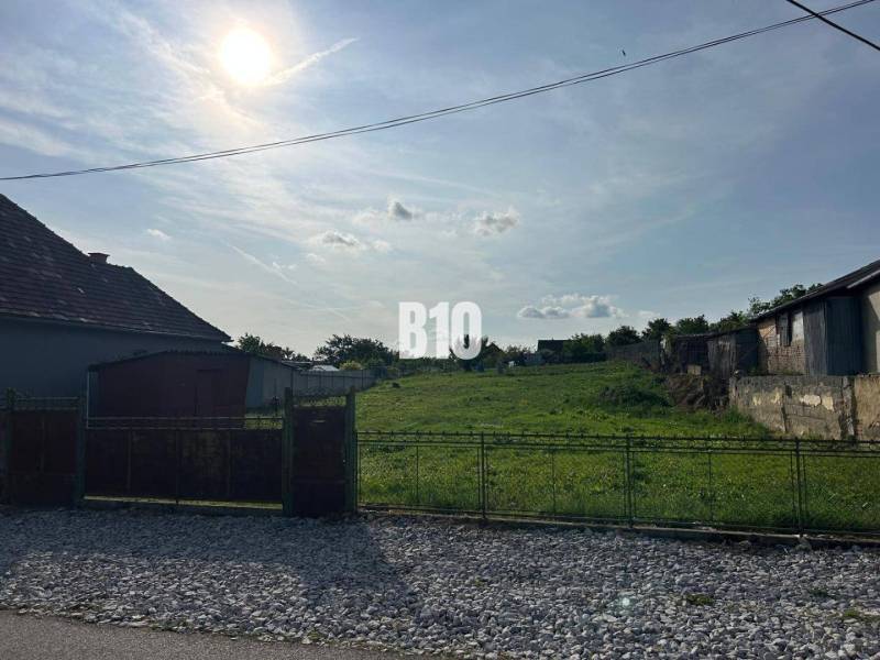 Plots - housing in Rumanová with a sunny view of a green grassy area.