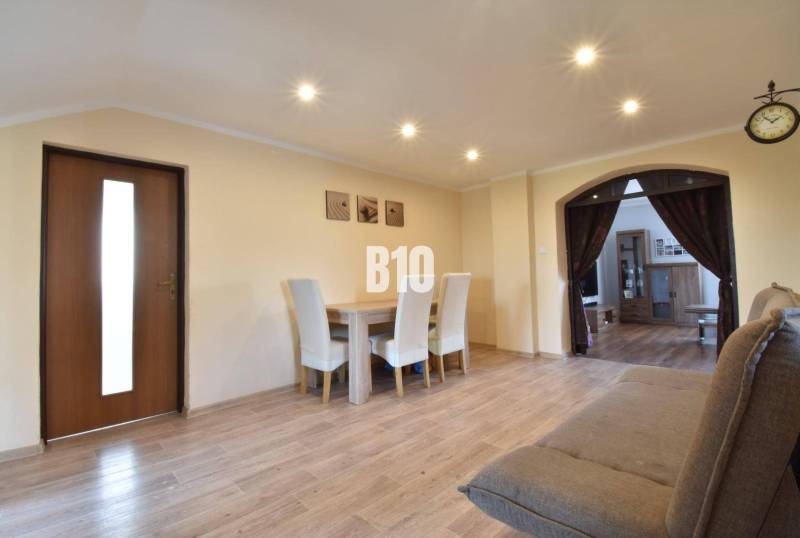 Interior design in a family house combining wooden elements with comfortable furniture.