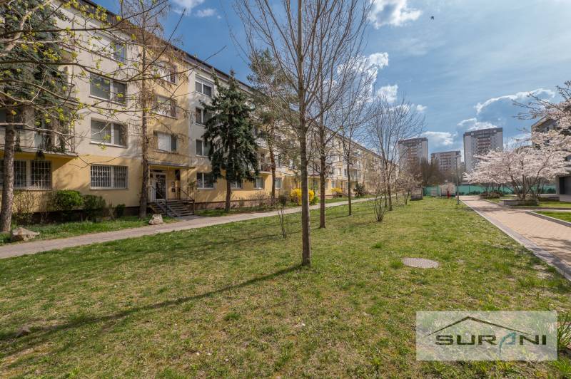 3-room apartment on Kostlivého Street in Bratislava - Ružinov, surrounded by greenery and walkways.