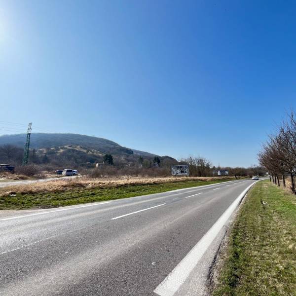 Road by the plots in Bratislava - Devínska Nová Ves with a view of the hills.